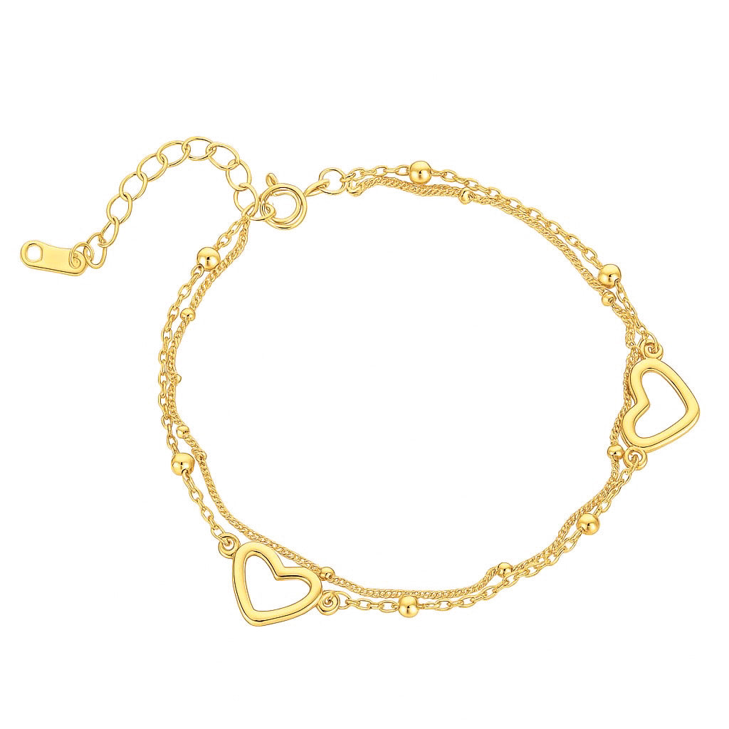 Brățară din argint placat cu aur, formată din două lanțuri subțiri cu biluțe decorative și două inimioare aurii decupate, dispuse simetric.