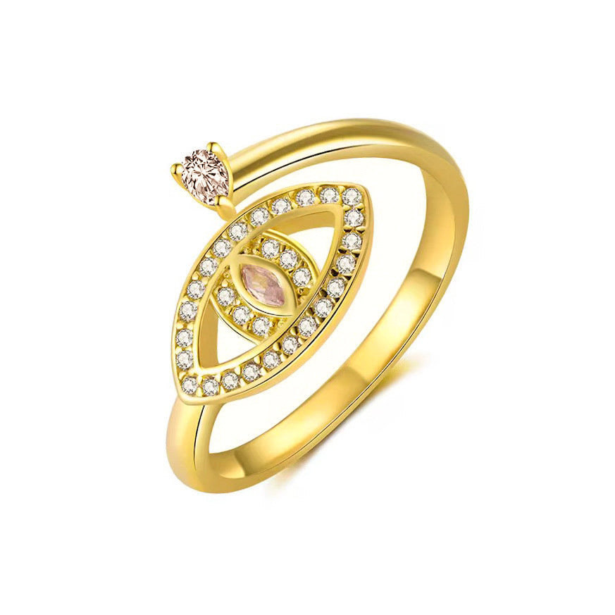 Inel reglabil din argint placat cu aur 18K, cu design în formă de ochi protector, decorat cu zirconii mici și o piatră roz marquise în centru, plus o piatră rotundă în partea superioară a inelului.